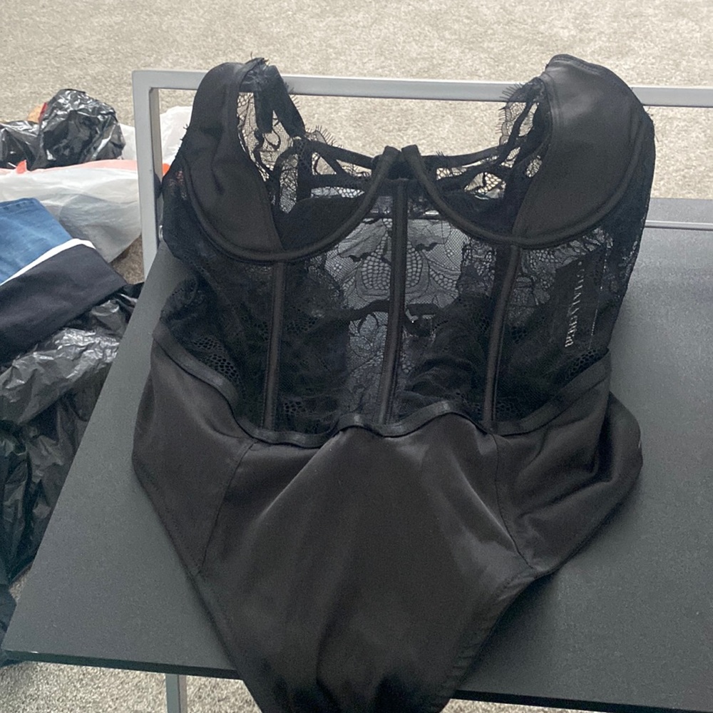 Womens black unlined shelf teddy with lace detail. Never worn.
